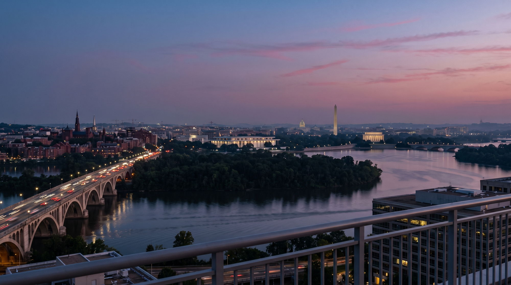 Washington at dusk from a Rosslyn rooftop in Arlington: Key Bridge and Georgetown on the left, Theodore Roosevelt Island in the Potomac, the Kennedy Center, Lincoln Memorial, Washington Monument and Capitol beyond